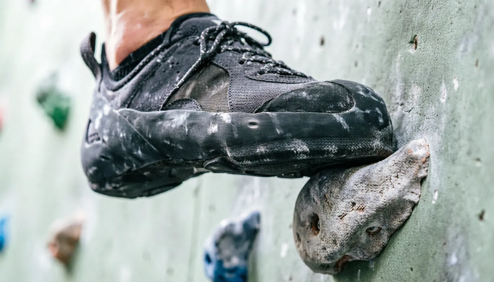 Close-up view of a technical climbing shoe fitting perfectly on a foot.